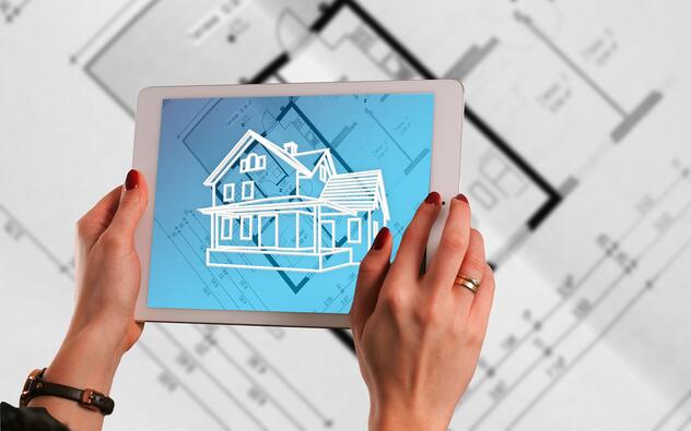 Een tablet waarop een huis te zien is in augmented reality